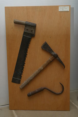 Saw,
      pick axe and hook